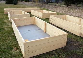 A group of newly built raised garden boxes.
