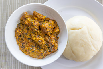 Nigerian Pounded Yam served with Spicy Bitterleaf soup