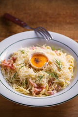 Carbonara pasta, spaghetti with pancetta, egg, parmesan cheese and cream sauce. Pasta alla carbonara - Italian cuisine dish