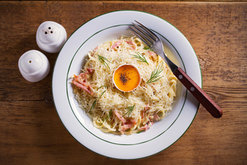 Carbonara pasta, spaghetti with pancetta, egg, parmesan cheese and cream sauce. Pasta alla carbonara - Italian cuisine dish