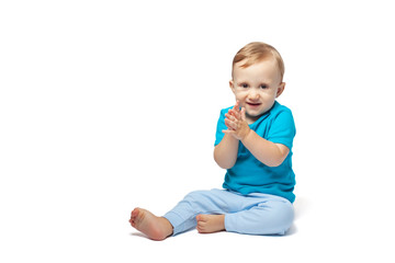 Cute baby boy playing isolated on the white background. Copy place