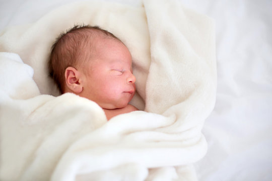 Newborn Baby Laying In Crib In Prenatal Hospital