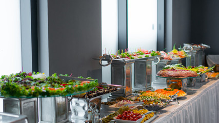 buffet dishes are on the table