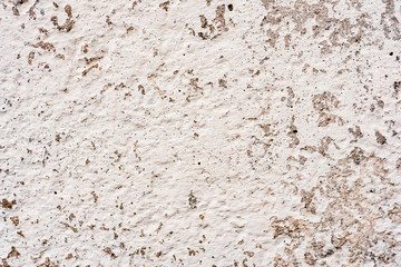 Texture of a concrete wall with cracks and scratches which can be used as a background