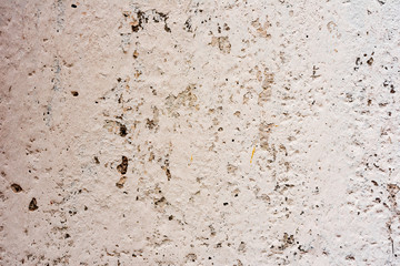 Texture of a concrete wall with cracks and scratches which can be used as a background