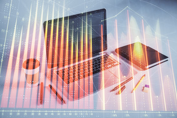 Forex graph hologram with desktop office computer background. Double exposure. Concept of financial...