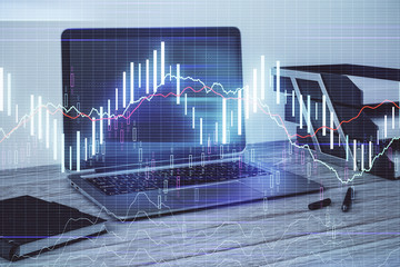 Stock market chart and desktop office computer background. Multi exposure. Concept of financial...