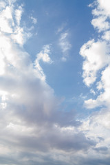 White fluffy clouds in the blue sky in summer