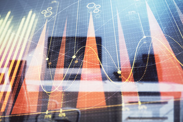 Stock market chart and desktop office computer background. Multi exposure. Concept of financial...