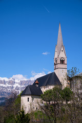 Fototapeta na wymiar Church in village Livinallongo del Col di Lana in Italy
