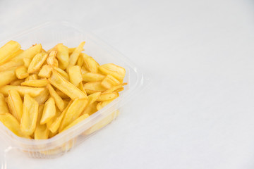 French fries in a convenient container ready to be taken away. Food menu
