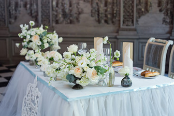 elegant wedding serving with white roses and candles