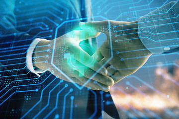 Double exposure of business theme drawing on cityscape background with handshake. Concept of partnership