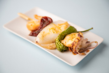 Skewer of sepia peppers and shrimp, typical Spanish tapa