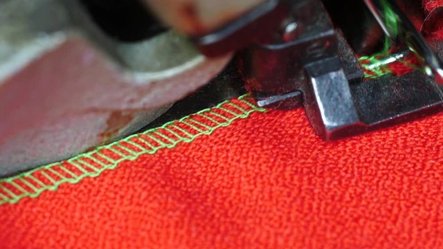 Overlock sewing mechanism in work macro shot