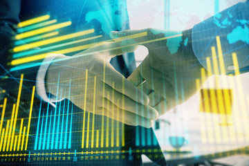Multi exposure of financial chart and map on office background with two businessmen handshake. Concept of success in business