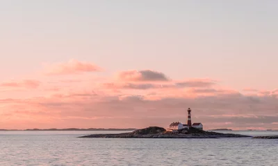 Wandaufkleber Landegode Lighthouse on the coast of Norway seen from the Hurtigruten ship MS Richard With © Eyolf