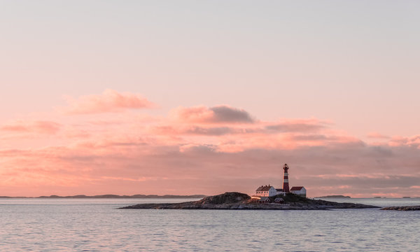 Landegode Lighthouse on the coast of Norway seen from the Hurtigruten ship MS Richard With