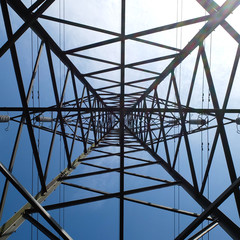 Looking up at a high voltage electricty pylon in England