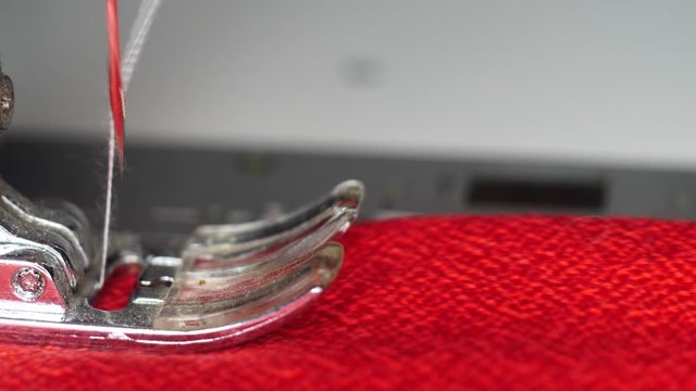 Modern sewing machine works slow motion macro shot