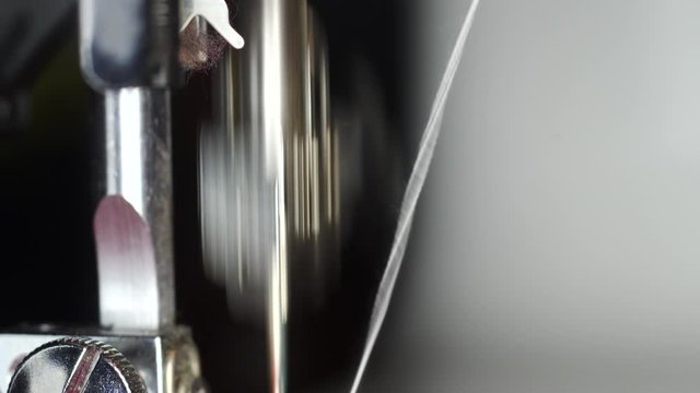 Modern sewing machine at work macro shot