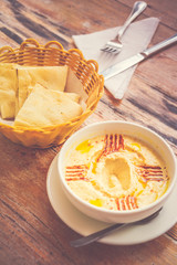 Hummus Pureed chickpeas, tahini, lemon, garlic drizzled with extra virgin oil served with pita bread