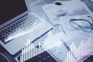 Forex Chart hologram on table with computer background. Multi exposure. Concept of financial markets.