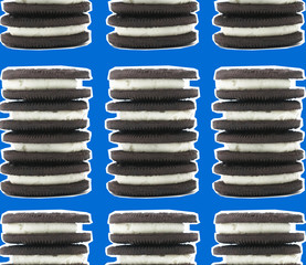 Chocolate creme filled cookie stack with white outline, pattern for pop art style dessert food.  Cookies and cream flavor concept.
