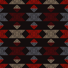 Fototapeta premium Ethnic boho seamless pattern. Lace. Embroidery on fabric. Patchwork texture. Weaving. Traditional ornament. Tribal pattern. Folk motif. Can be used for wallpaper, textile, wrapping, web. 