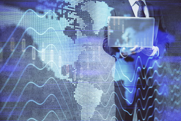 Forex graph with businessman working on laptop on background. Concept of hardworking. Multi exposure.