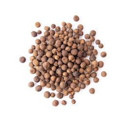 Allspice berries (also called Jamaican pepper or newspice) over white background. top view