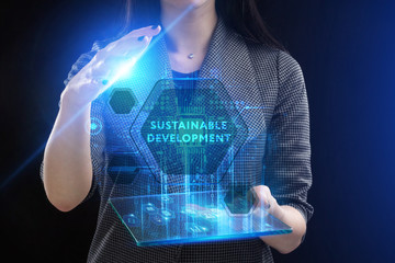 The concept of business, technology, the Internet and the network. A young entrepreneur working on a virtual screen of the future and sees the inscription: Sustainable development