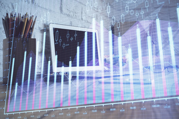 Financial graph colorful drawing and table with computer on background. Double exposure. Concept of international markets.