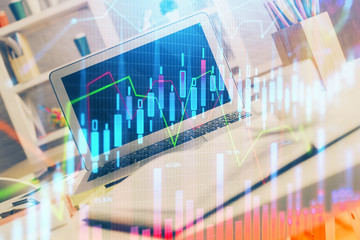 Forex market chart hologram and personal computer background. Multi exposure. Concept of investment.