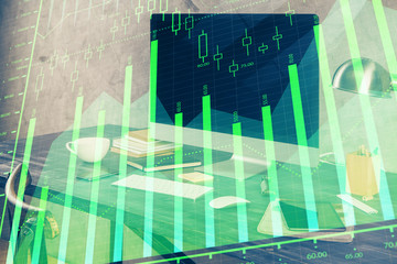 Financial chart drawing and table with computer on background. Double exposure. Concept of international markets.