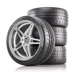 Four of car wheels. New shiny tires. 3d render - obrazy, fototapety, plakaty