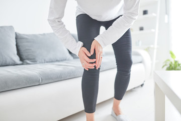 Fototapeta na wymiar Physical injury of leg / knee / joint at home.