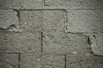 Texture of a gray brick wall.
