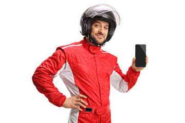 Car racer with a helmet holding a smartphone