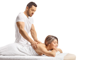 Master masseur giving a professional massage to a woman