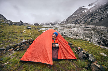 Hiker in the tent outdoor