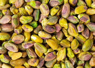 raw pistachio nuts isolated on white