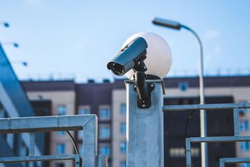 security camera at the entrance to the courtyard of a residential building