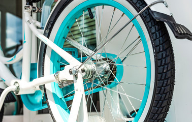 Rear wheel from bicycle with turquoise rim