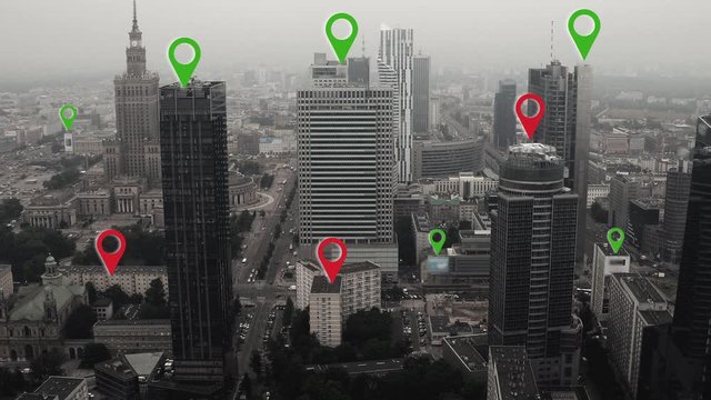 Aerial shot of Warsaw city center with localization icons.