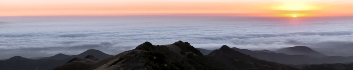 Panoramic Sunset Views towards Monterey County and the Pacific Ocean covered with Fog. Fremont Peak State Park, San Benito County and Monterey County, California, USA.