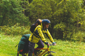 Fototapeta na wymiar bicycle tourist in the autumn forest