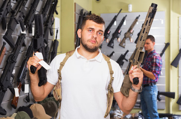 Men choosing air weapon