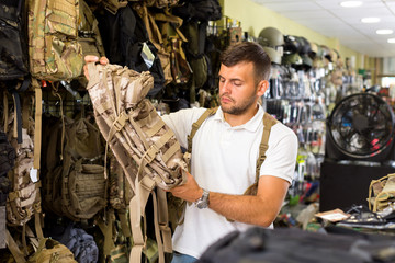 Male customer choise camouflage bag