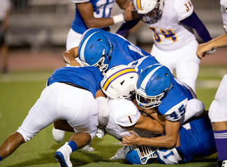 Action photos of high school football players making amazing plays during a football game © Joe
